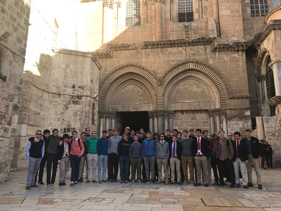 Heights Holy Land Pilgrimage in at the Entrance to the Holy Sepulchre in Jerusalem
